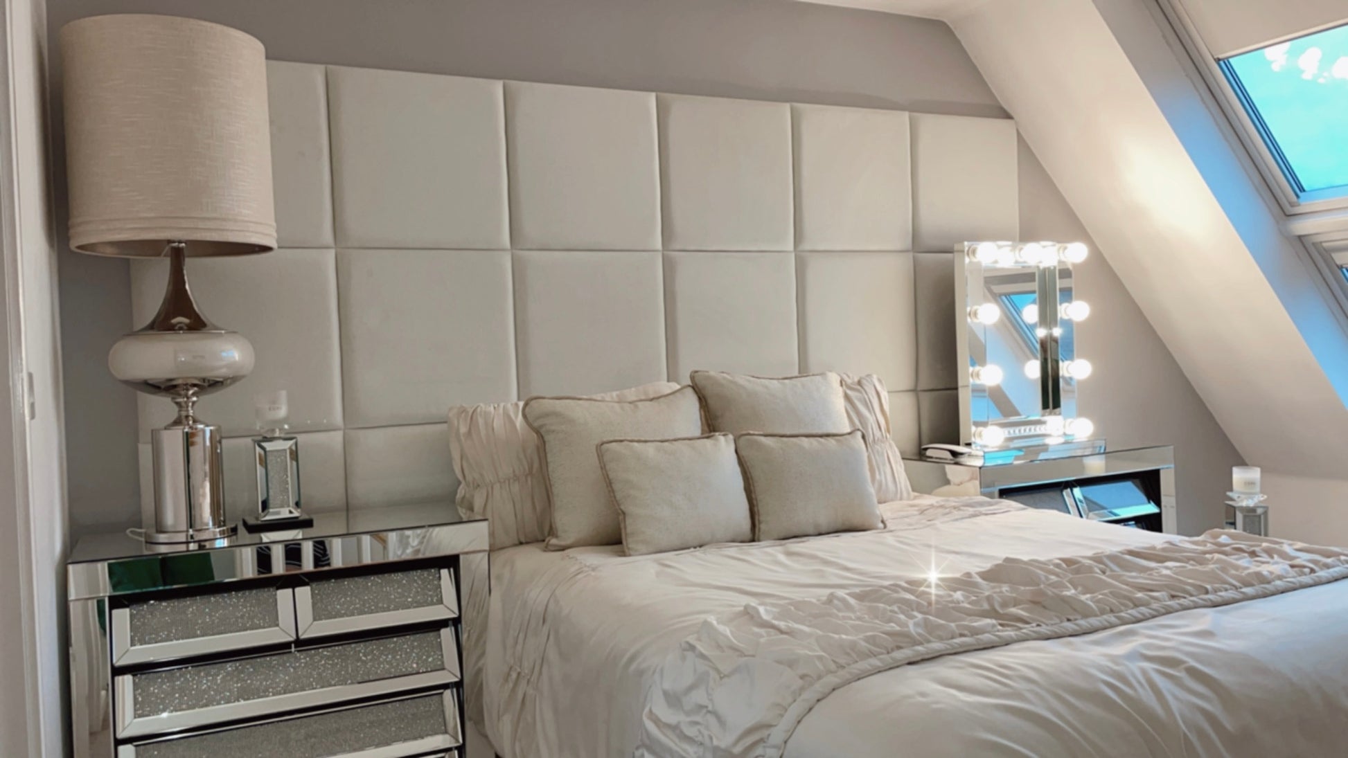 50 x 50 Velvet wall panels in a 6 x 3 configuration, shown in a bedroom environment with double bed, lamp, homemade cushions, light up mirror and bedside cabinets.