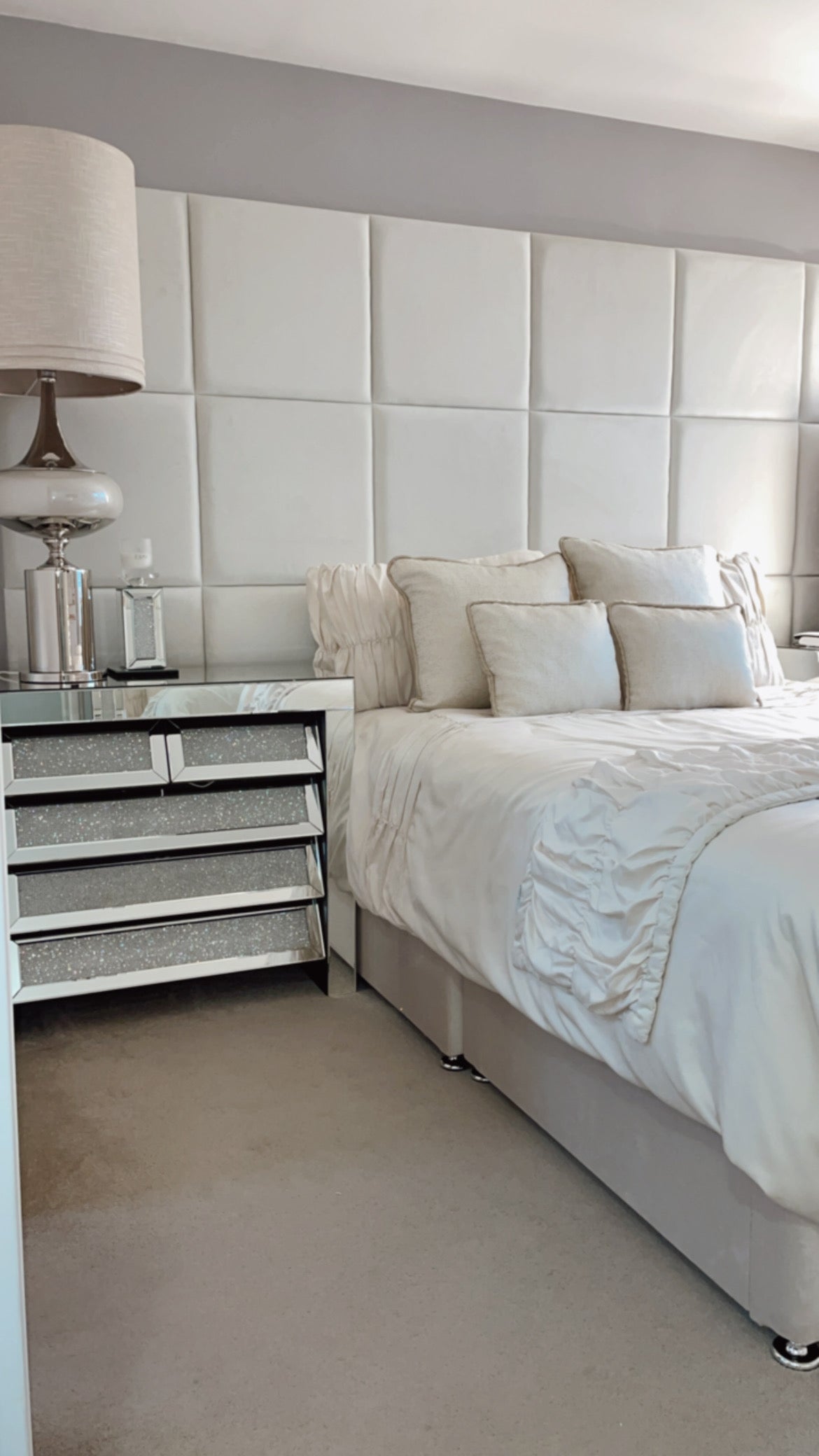 50 x 50 Velvet wall panels in a 6 x 3 configuration, shown in a bedroom environment with double bed, set of draws and lamp.