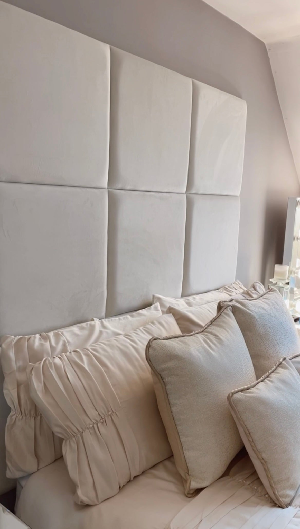 50 x 50 Velvet wall panels in a 3 x 3 configuration, shown in a bedroom environment with home made cushions.