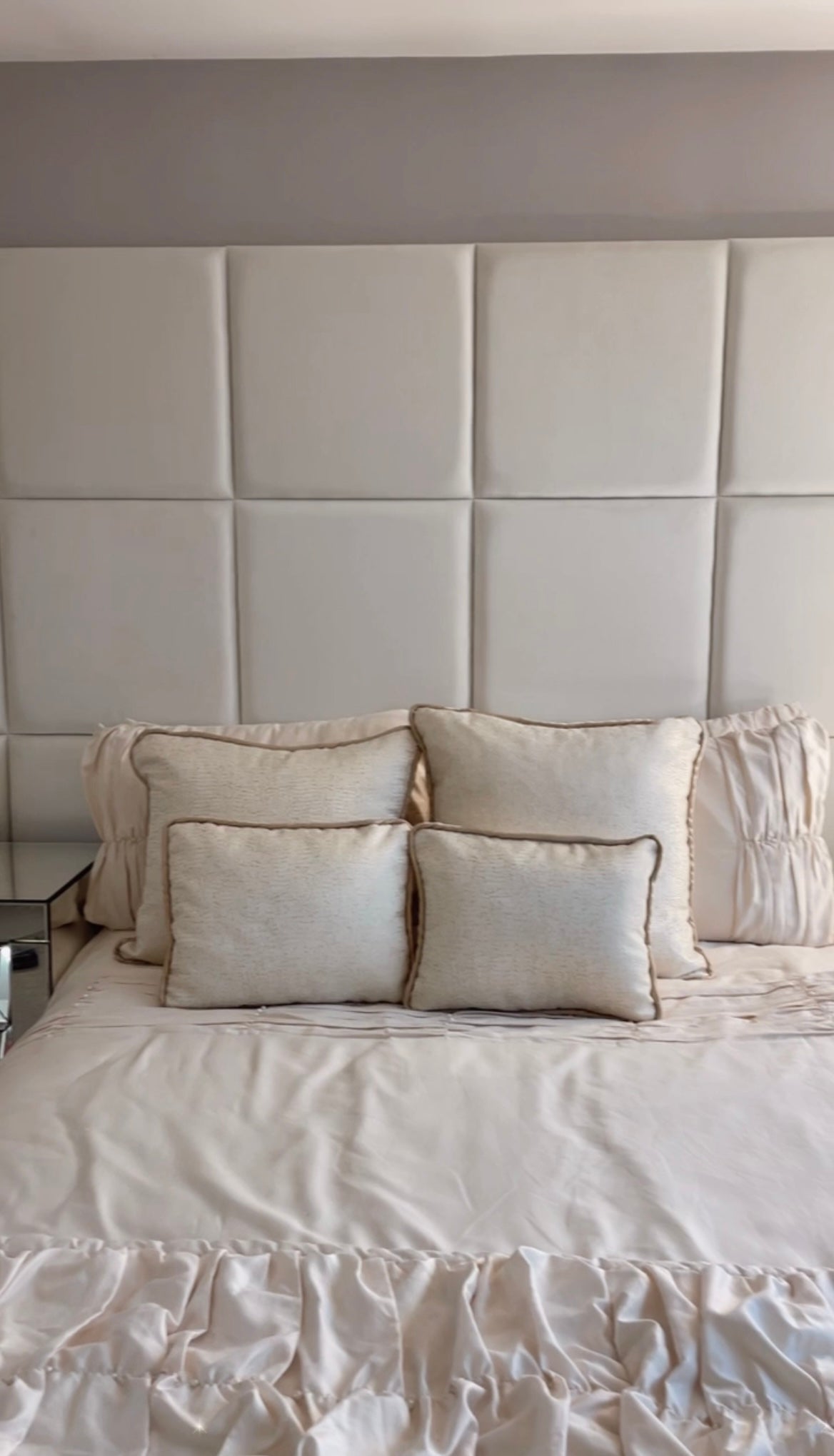 50 x 50 Velvet wall panels in a 4 x 3 configuration, shown in a bedroom environment with a double bed, home made cushions and a throw.