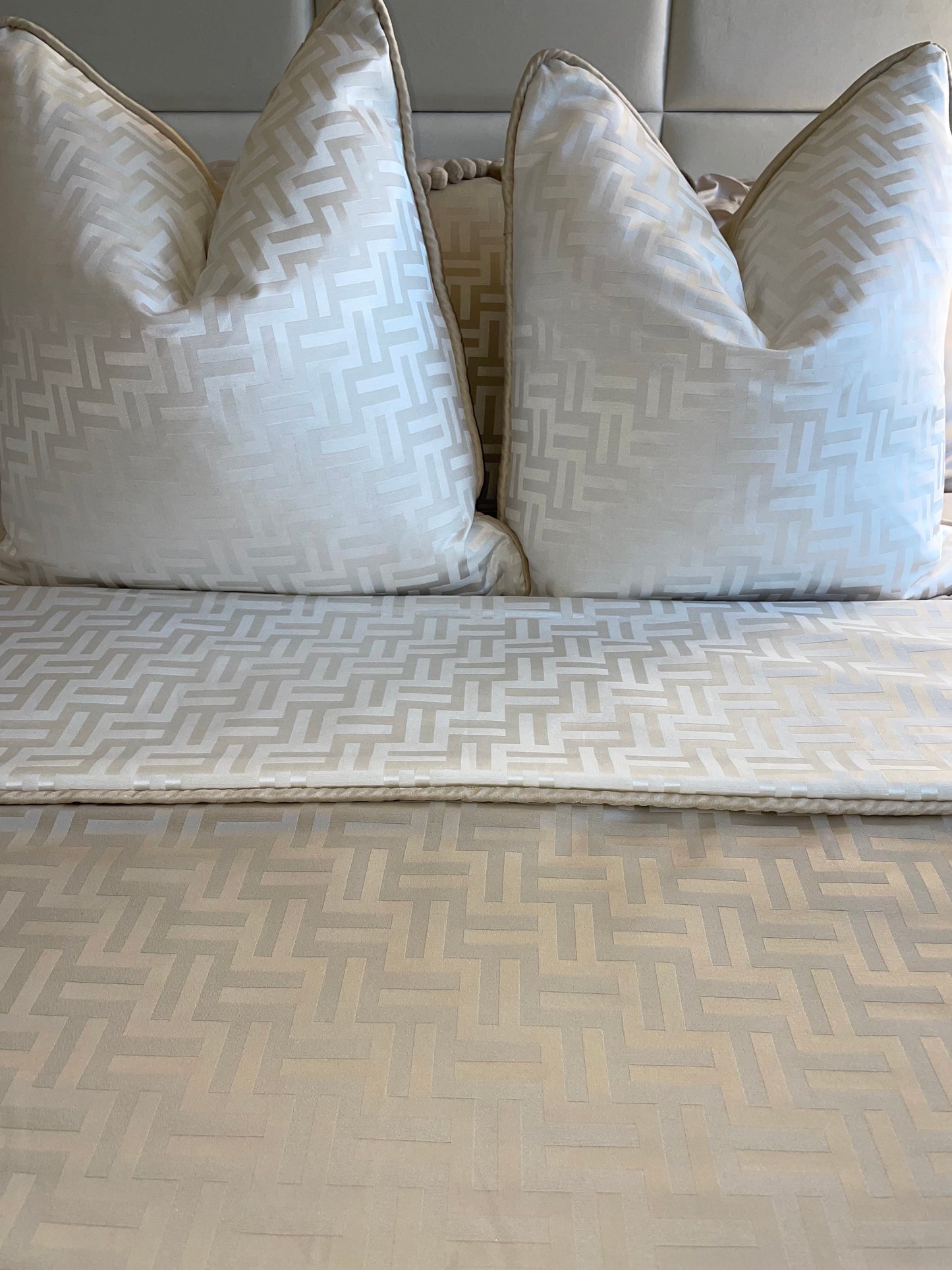 2 Florence Cushion in Beige or White, shown with the matching throw..