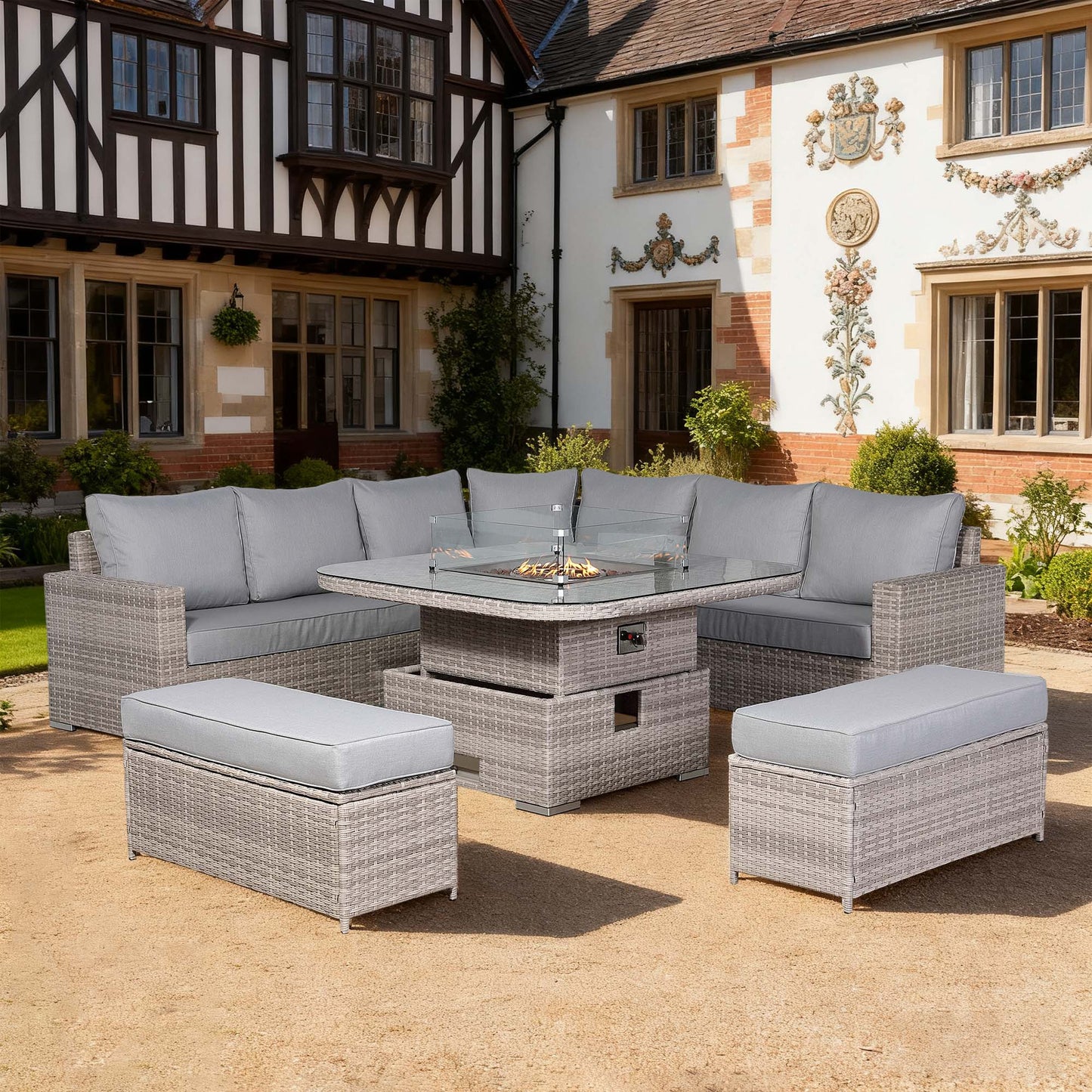 Outdoor patio set with gray cushions in front of a historic building