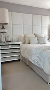 50 x 50 Velvet wall panels in a 6 x 3 configuration, shown in a bedroom environment with double bed, set of draws and lamp.