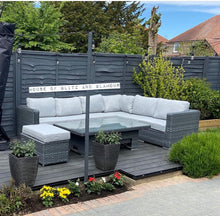 Load image into Gallery viewer, Monte Carlo Rattan Wide Corner Sofa Dining Set In Grey on decking with bushes.