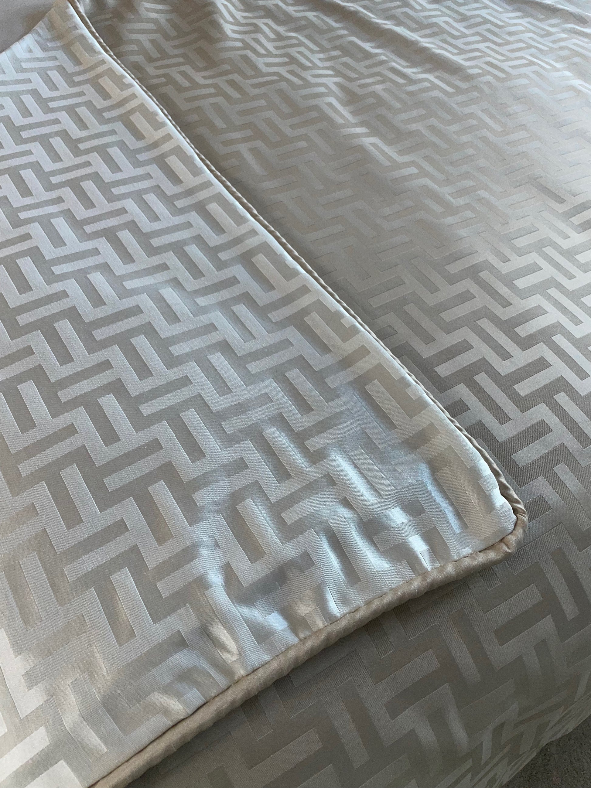 Close up of Florence Reversible Throw in Beige and White