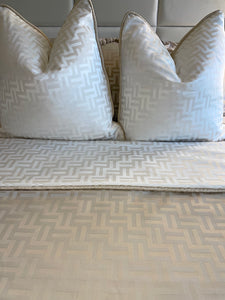 2 Florence Cushion in Beige or White, shown with the matching throw..